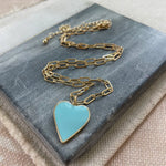 Fine rectangle link gold chain with a light blue enamel heart pendant.